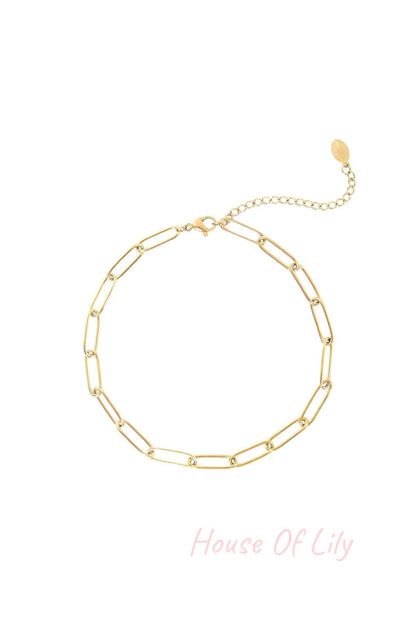 Gold-tone chain link anklet with lobster clasp and extension chain on a white background