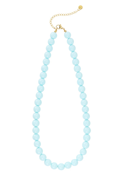 Light pink resin beaded necklace with gold chain extender and clasp on white background