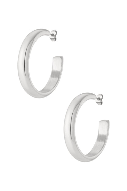 Pair of polished silver chunky hoop earrings featuring thick rounded hoops with post closure