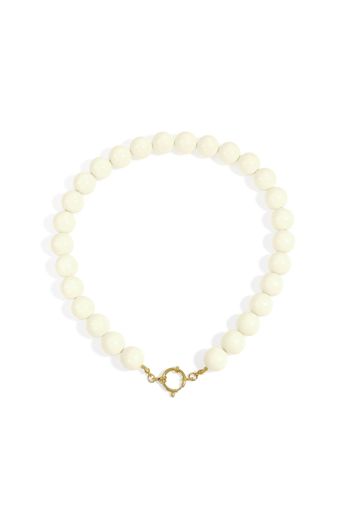 Chunky beige resin beaded necklace with gold clasp on white background
