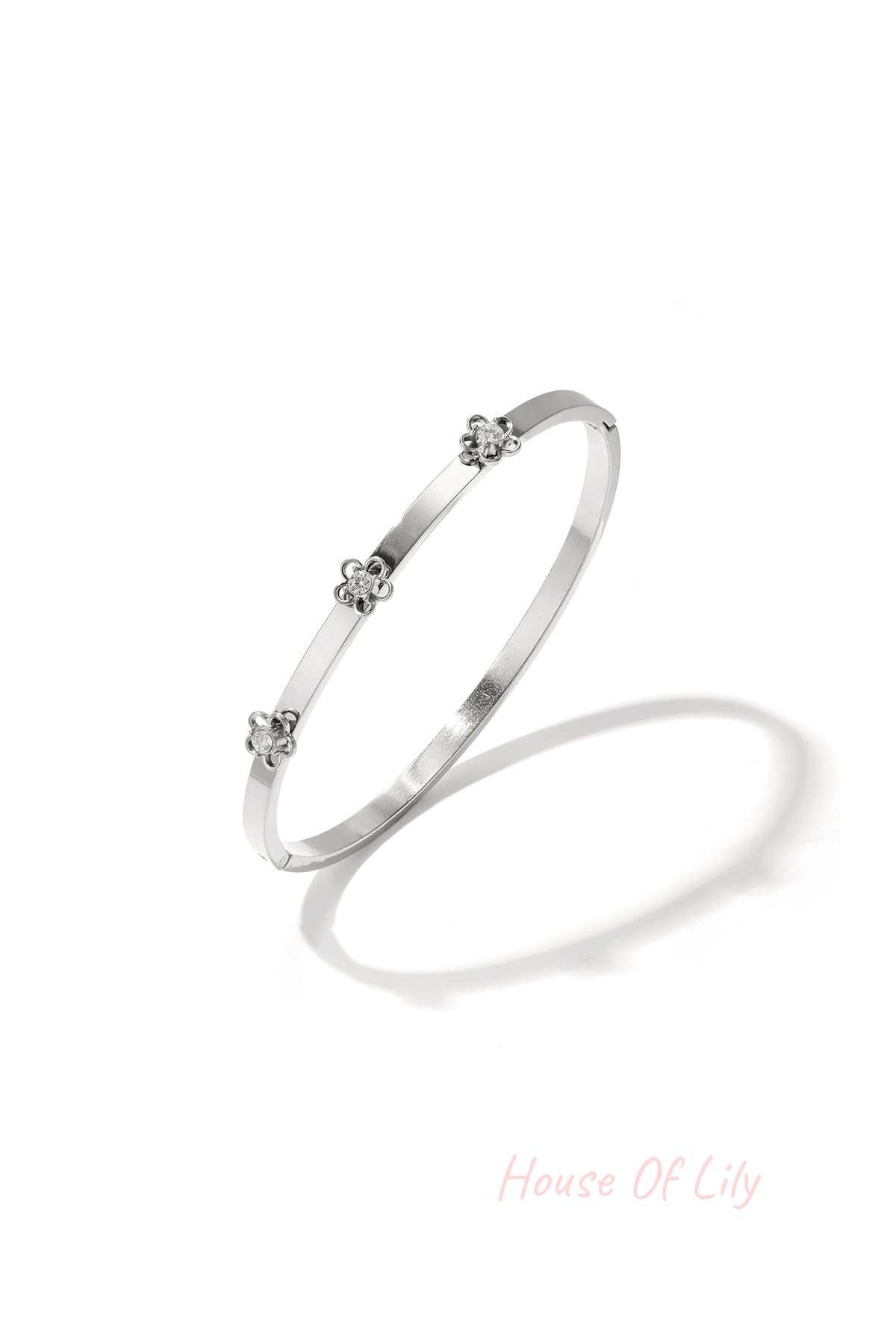 Bangle with floral detail and rhinestone