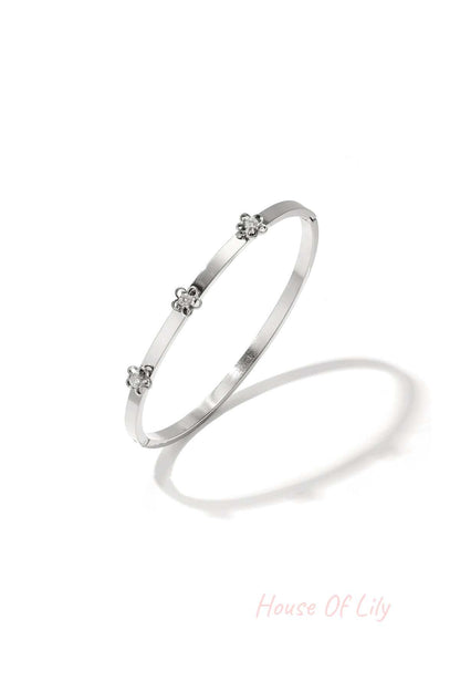 Bangle with floral detail and rhinestone