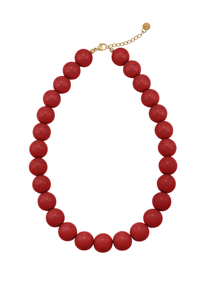 Cream chunky resin beaded necklace with gold chain clasp photographed on white background