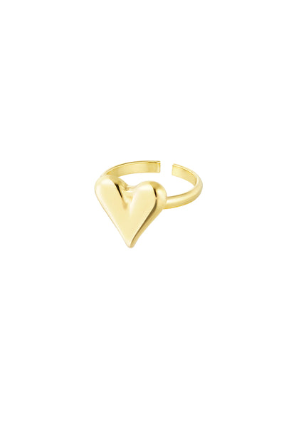Close-up of a gold adjustable ring with a shiny puffy heart design on a white background