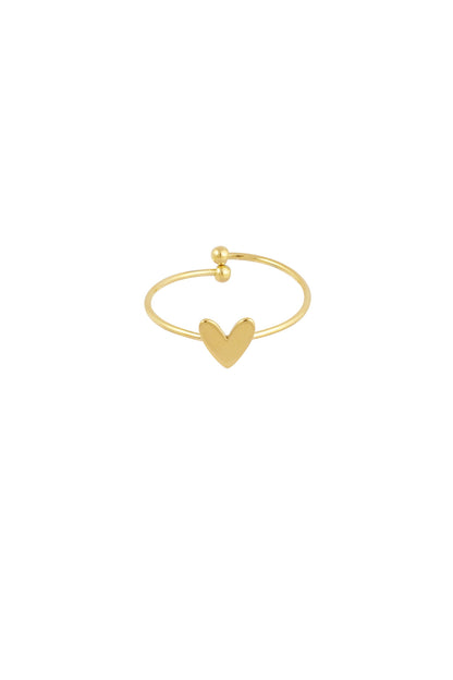 Close-up of delicate gold-tone minimalist open ring with heart charm on white background