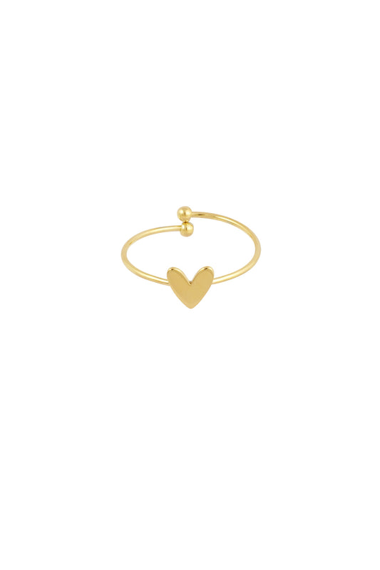 Close-up of delicate gold-tone minimalist open ring with heart charm on white background