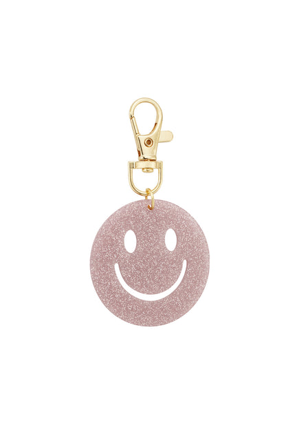 Bright green glitter smiley face keychain displayed on white background