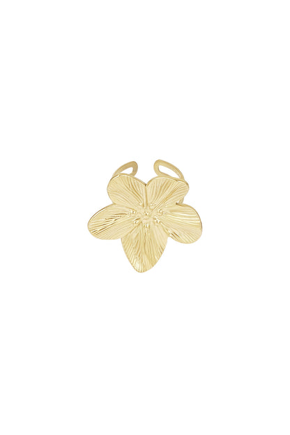 Close-up of gold flower shaped statement ring with textured petals on white background