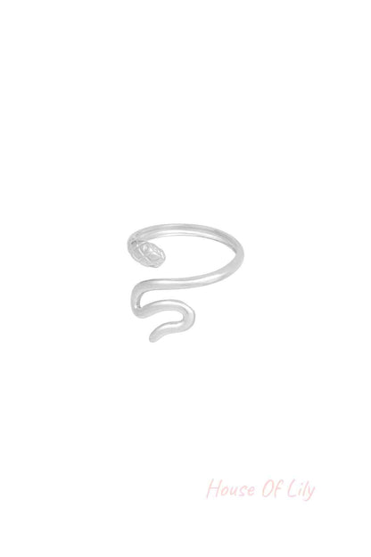Alternative angle of silver snake ring showing smooth curves and textured snake head