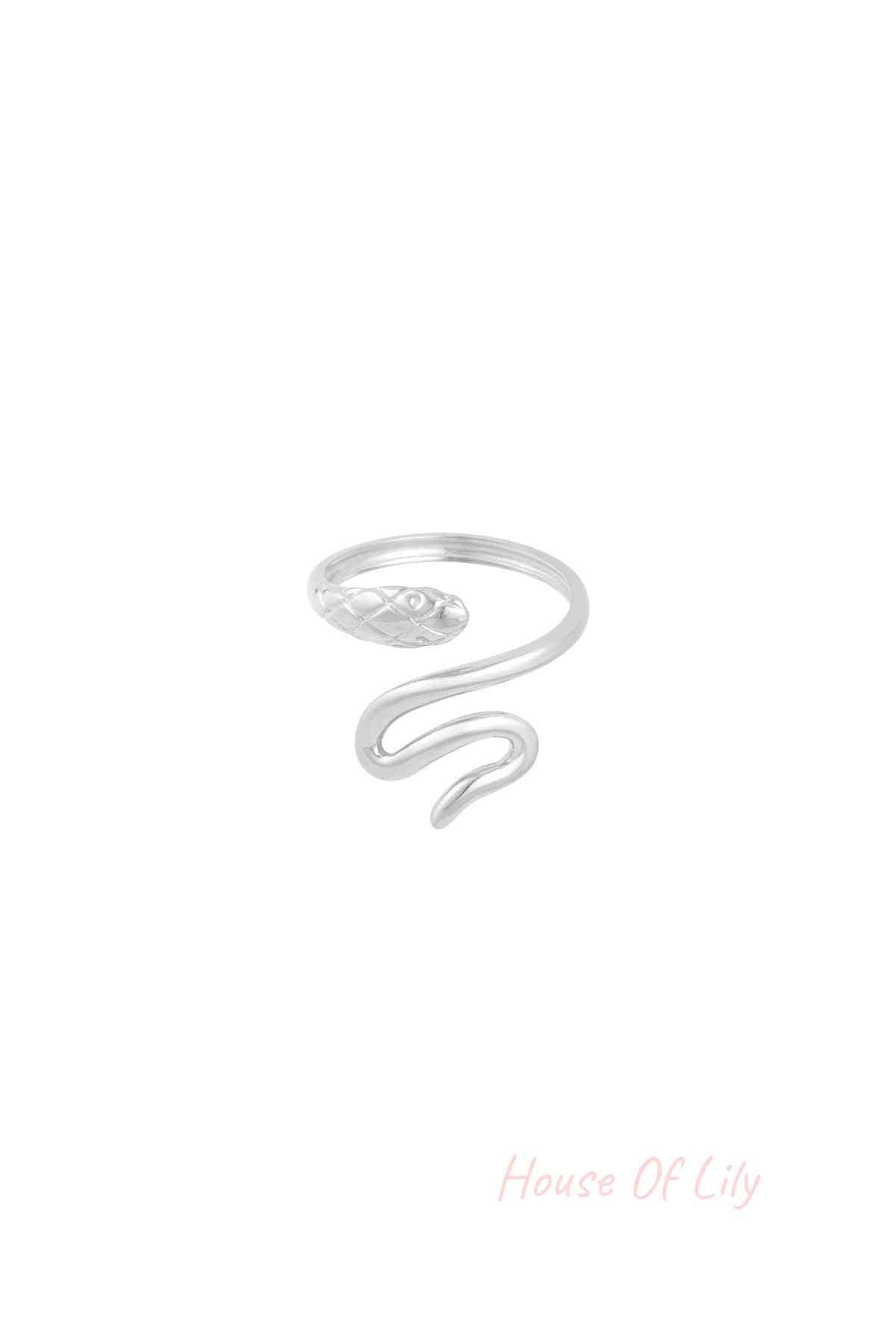 Silver snake statement ring with coiling design, isolated on white background