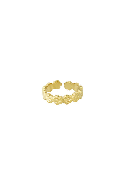 Close-up image of a gold open band ring featuring a delicate embossed floral pattern on a white background