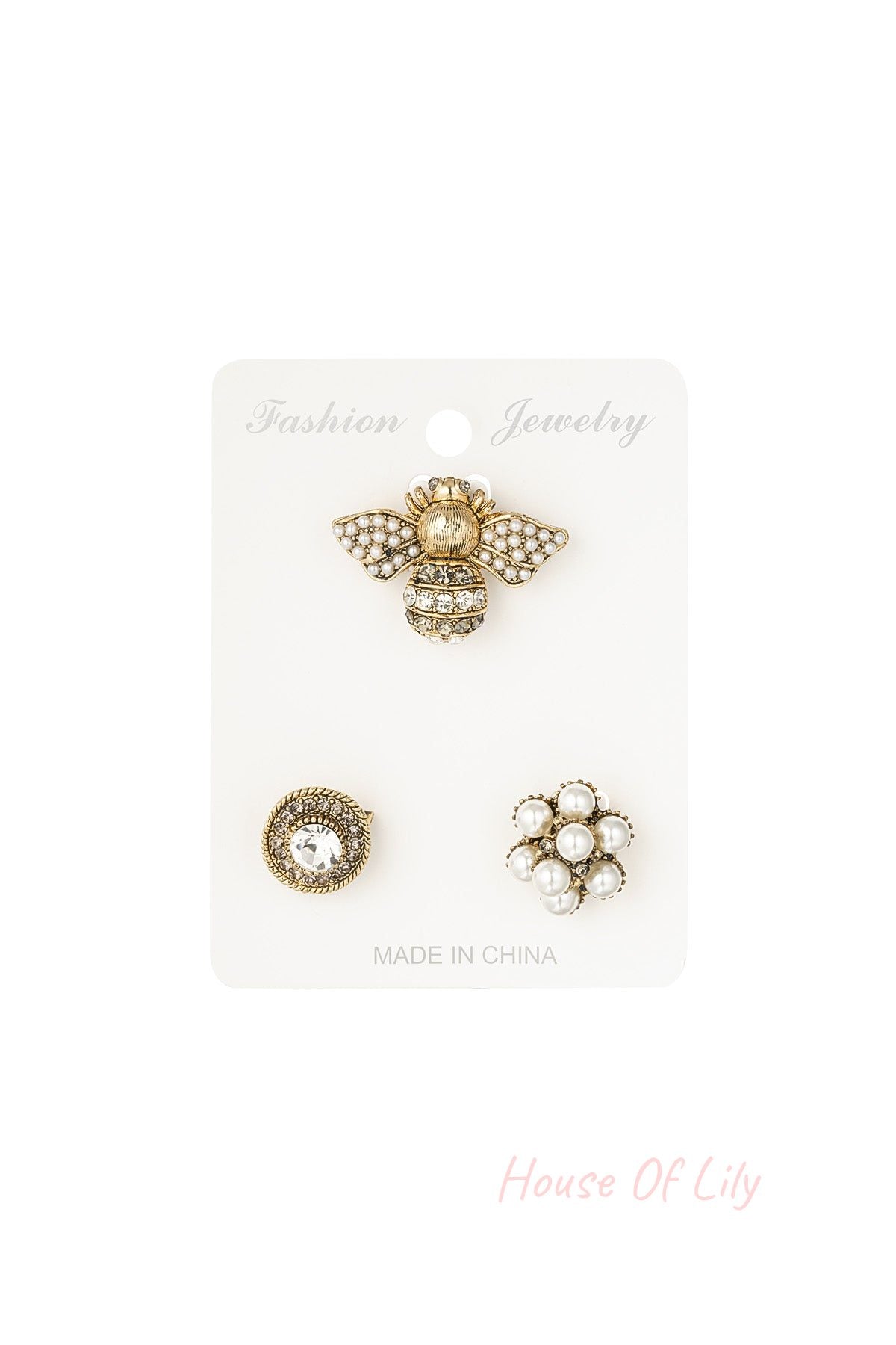 Set of three women's brooches displayed on a white backing card labeled 'Fashion Jewelry', including a pearl-studded bee, a circular rhinestone brooch, and a pearl flower cluster