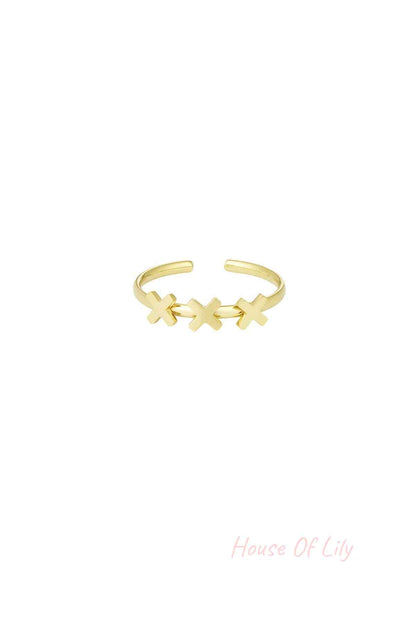 Gold-tone adjustable ring with three cross shapes on a white background