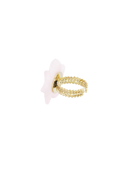 Side view of adjustable gold-tone band with leaf design on pink floral ring