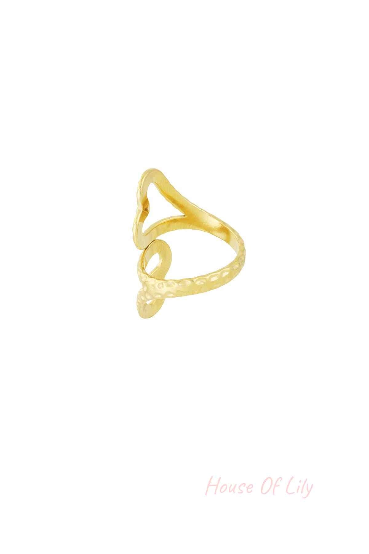 Side view of gold open heart ring highlighting its hammered texture and adjustable band