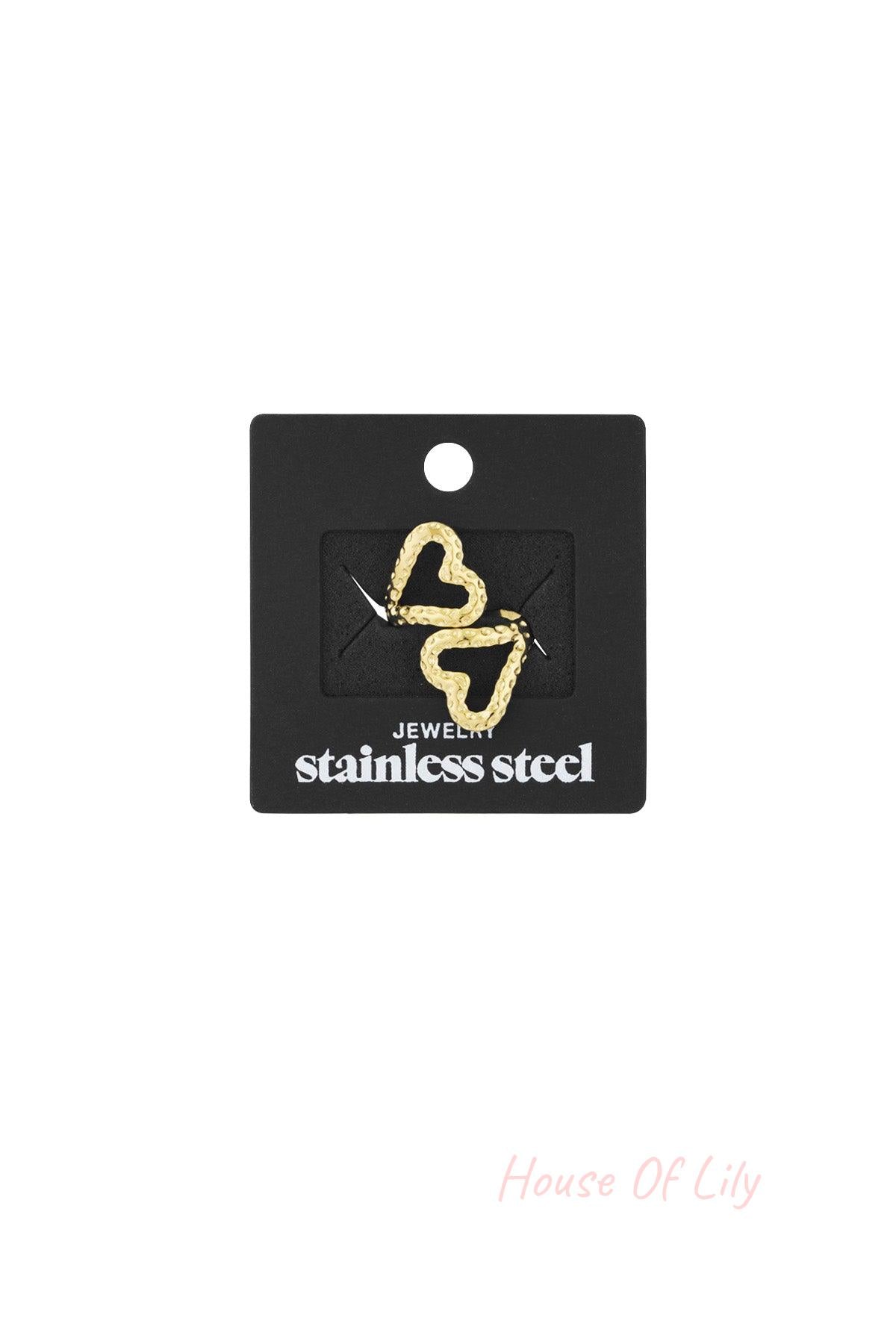 Gold textured open heart ring displayed on black packaging card labeled stainless steel