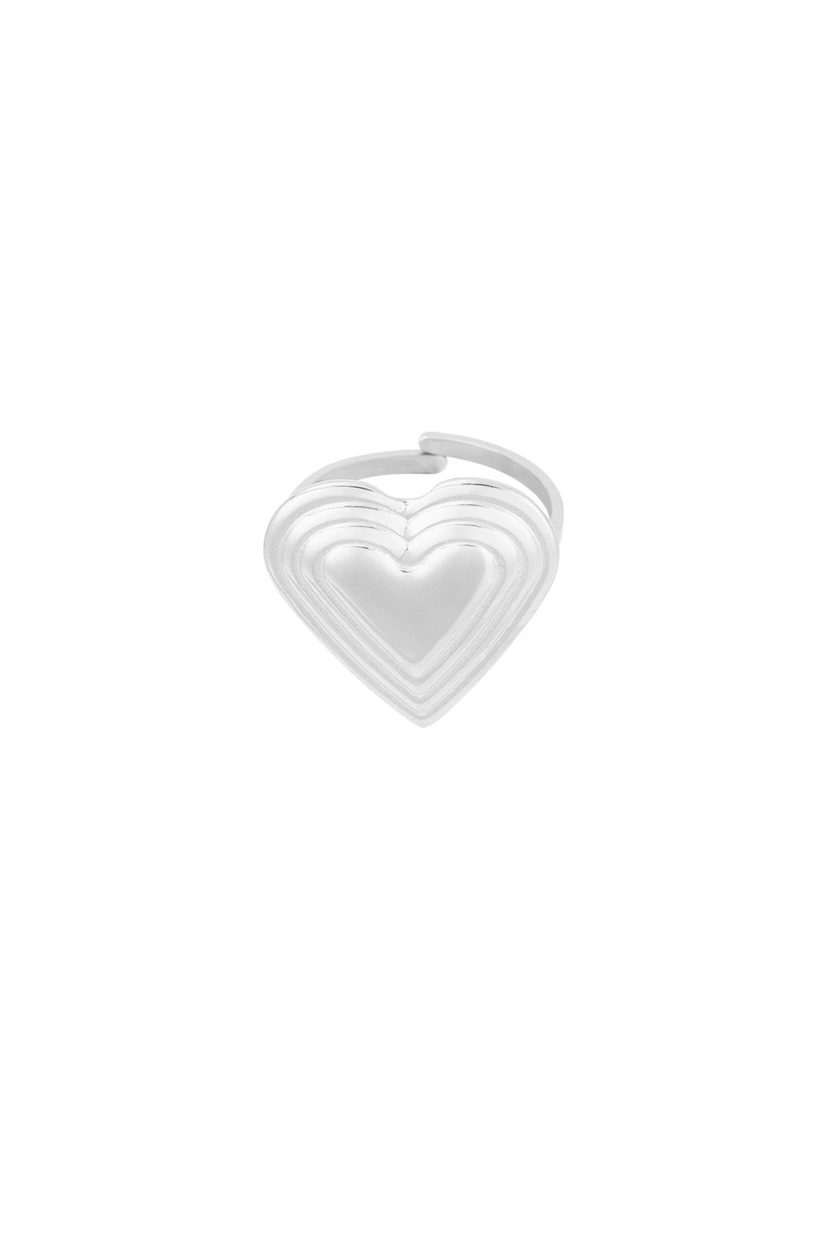 Front view of a silver-toned stainless steel ring with layered heart detail on white background