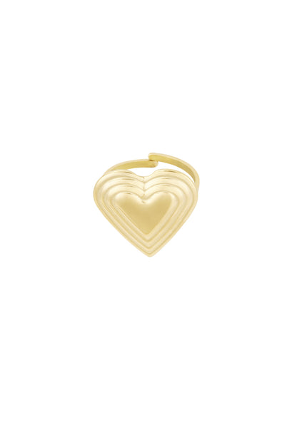 Close-up of a gold-toned stainless steel ring with a layered heart design on white background