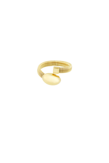 Close-up of a gold-tone coil ring with an oval and a small square end detail on white background
