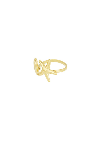 Side view of gold-tone open ring displaying starfish and seashell designs