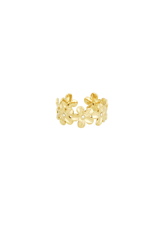 Gold daisy flower statement ring with crystal centres on white background