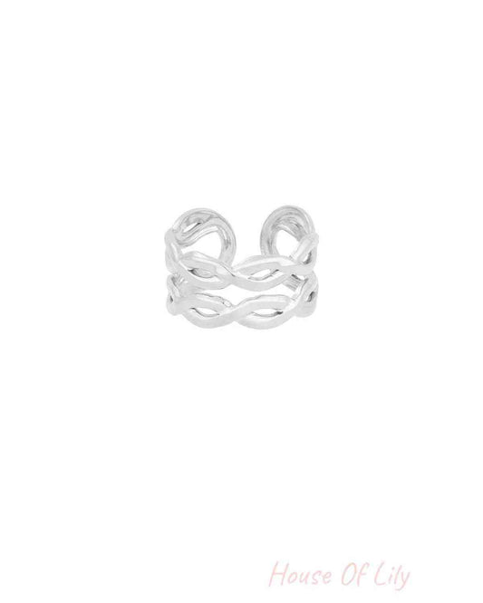 Silver Double Twist ring with a minimalist, open-band design featuring two delicate interwoven strands.