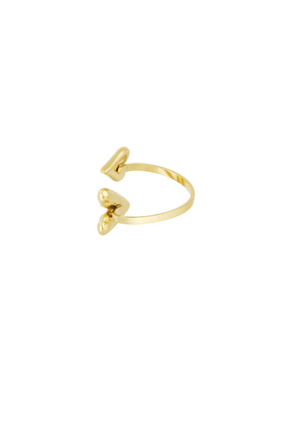 Gold adjustable wrap ring showing contrasting smooth and hammered heart details on white background