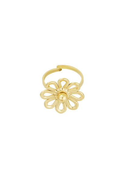 Close-up of gold flower statement ring with textured looping petals on white background