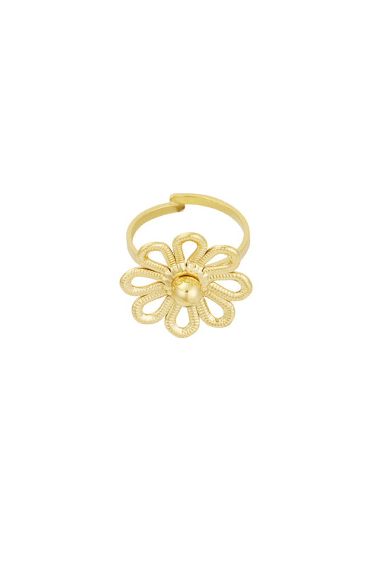 Close-up of gold flower statement ring with textured looping petals on white background