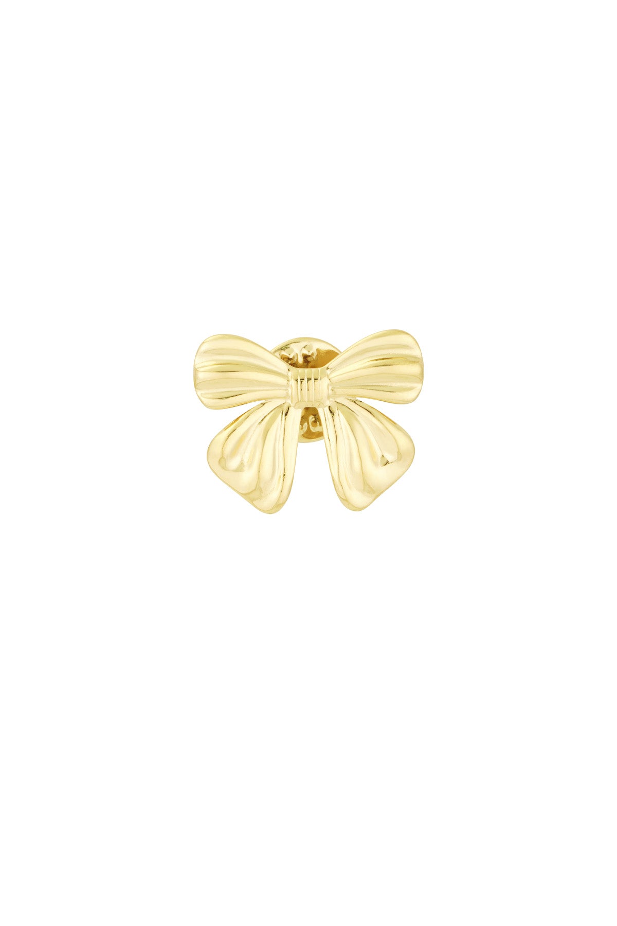 Close-up of polished gold bow-shaped brooch with smooth curves on white background