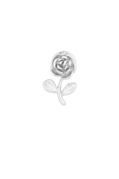 Close-up of a silver rose-shaped brooch with intricate petal and leaf details on a white background