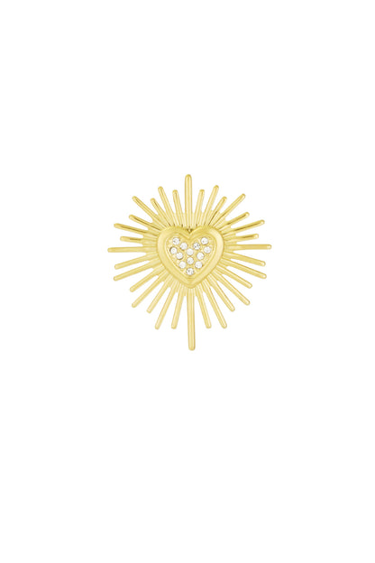 Gold tone brooch featuring a radiant sunburst design with a heart center adorned with sparkling clear stones on white background
