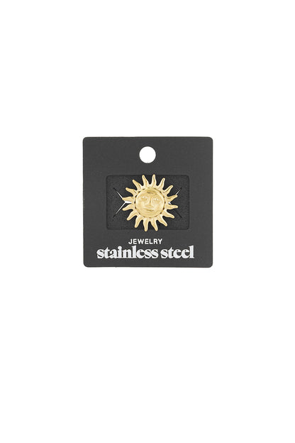 Gold sun brooch displayed on a black jewelry card labeled stainless steel, ready for retail