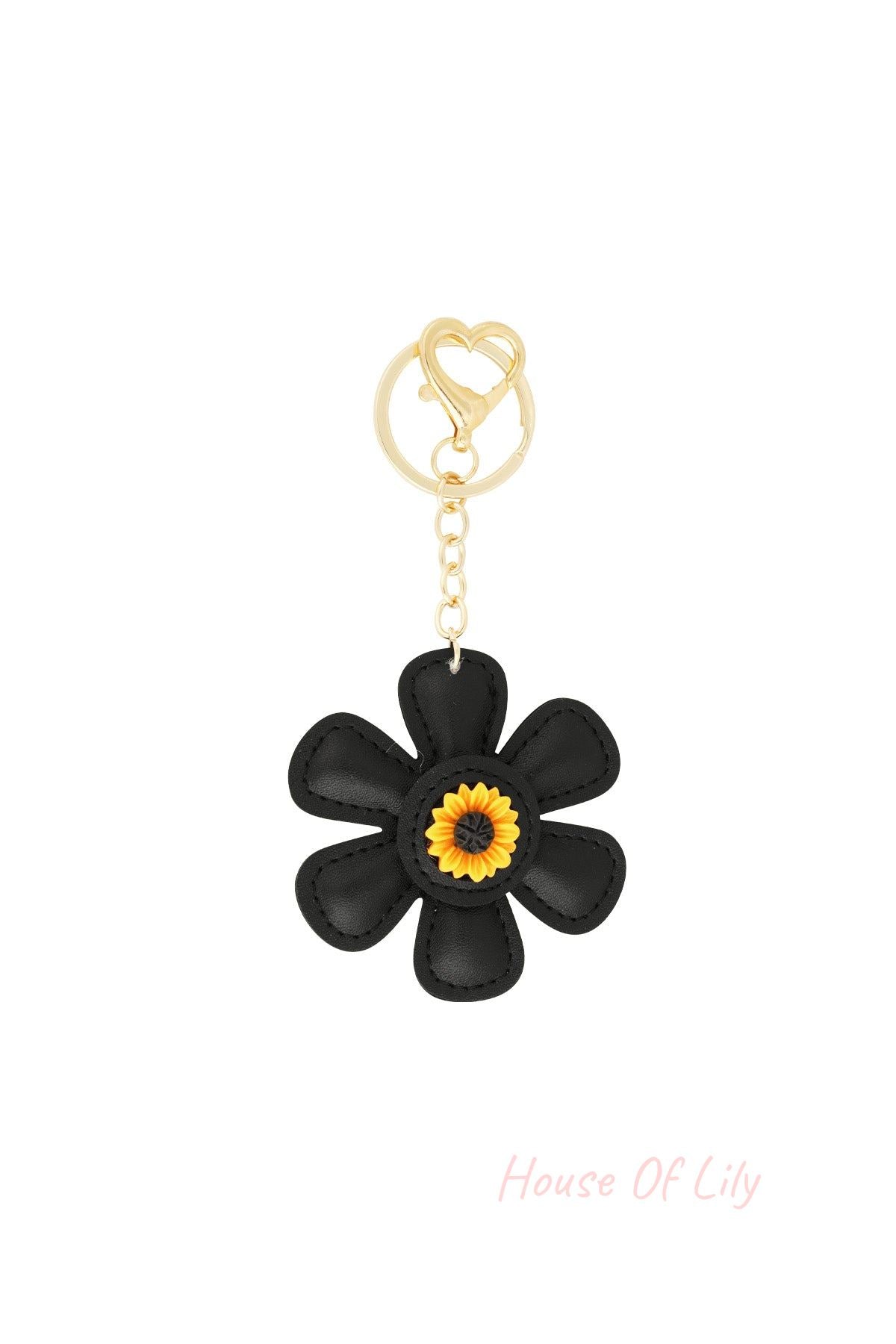 Black faux leather floral keychain with a gold heart clasp and sunflower center