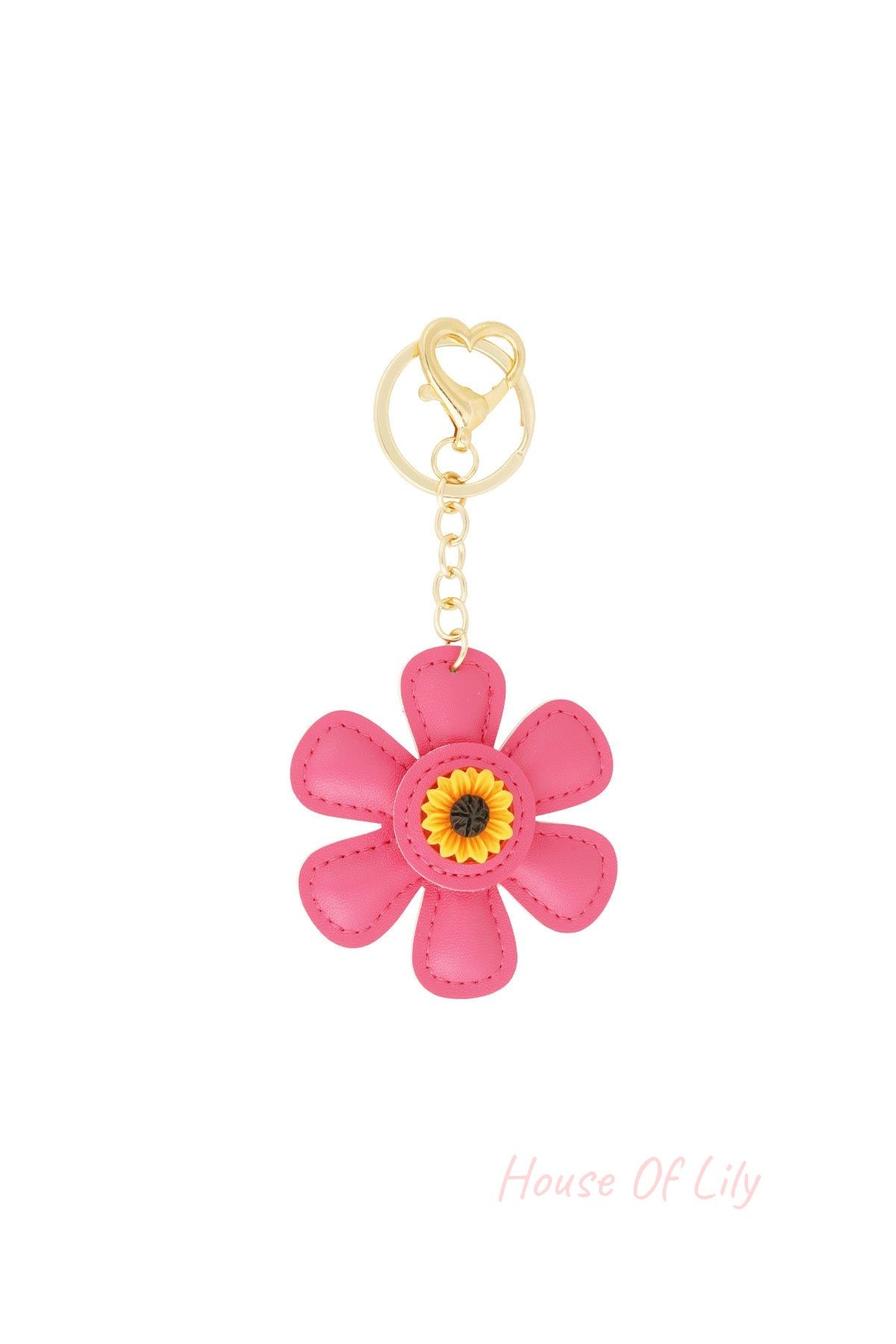 Pink faux leather floral keychain with sunflower center and gold heart clasp on white background