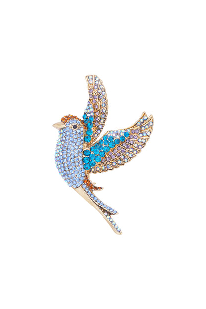 Close-up of sparkling bird brooch with blue, purple, and orange rhinestones on alloy base