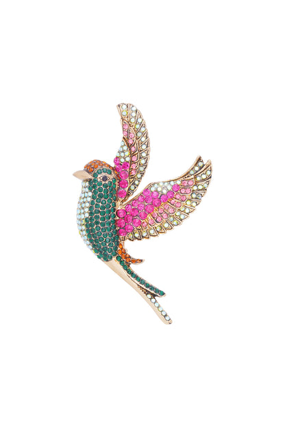 Close-up of sparkling bird brooch with green, pink, and orange rhinestones on alloy base