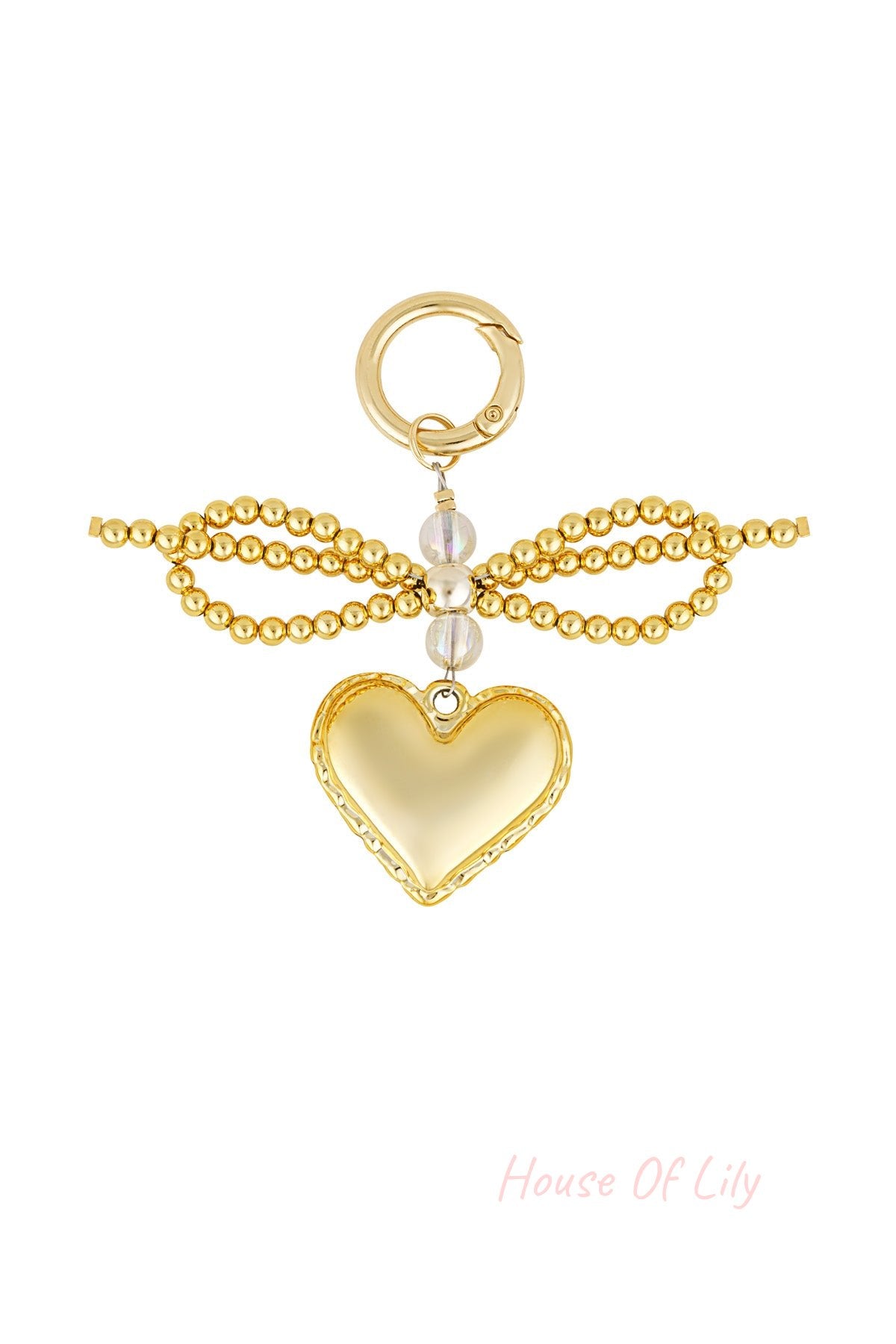Golden heart pendant keychain with a decorative bow made of gold beads and clear round beads on a white background