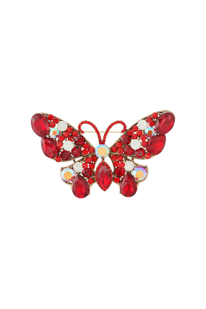 Ruby red and white crystal butterfly brooch with iridescent accents on a gold alloy base