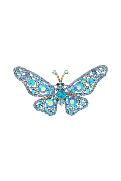 Turquoise and blue rhinestone butterfly brooch with gold alloy frame on a white background