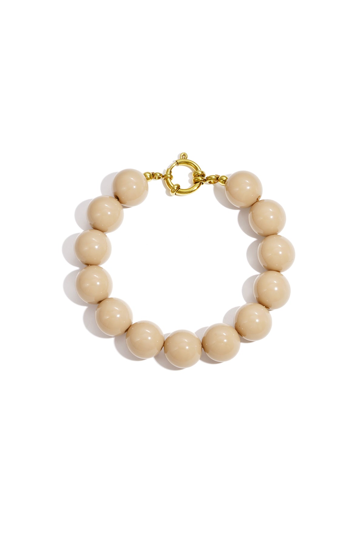 Beige chunky beaded bracelet featuring high-gloss resin beads and gold clasp