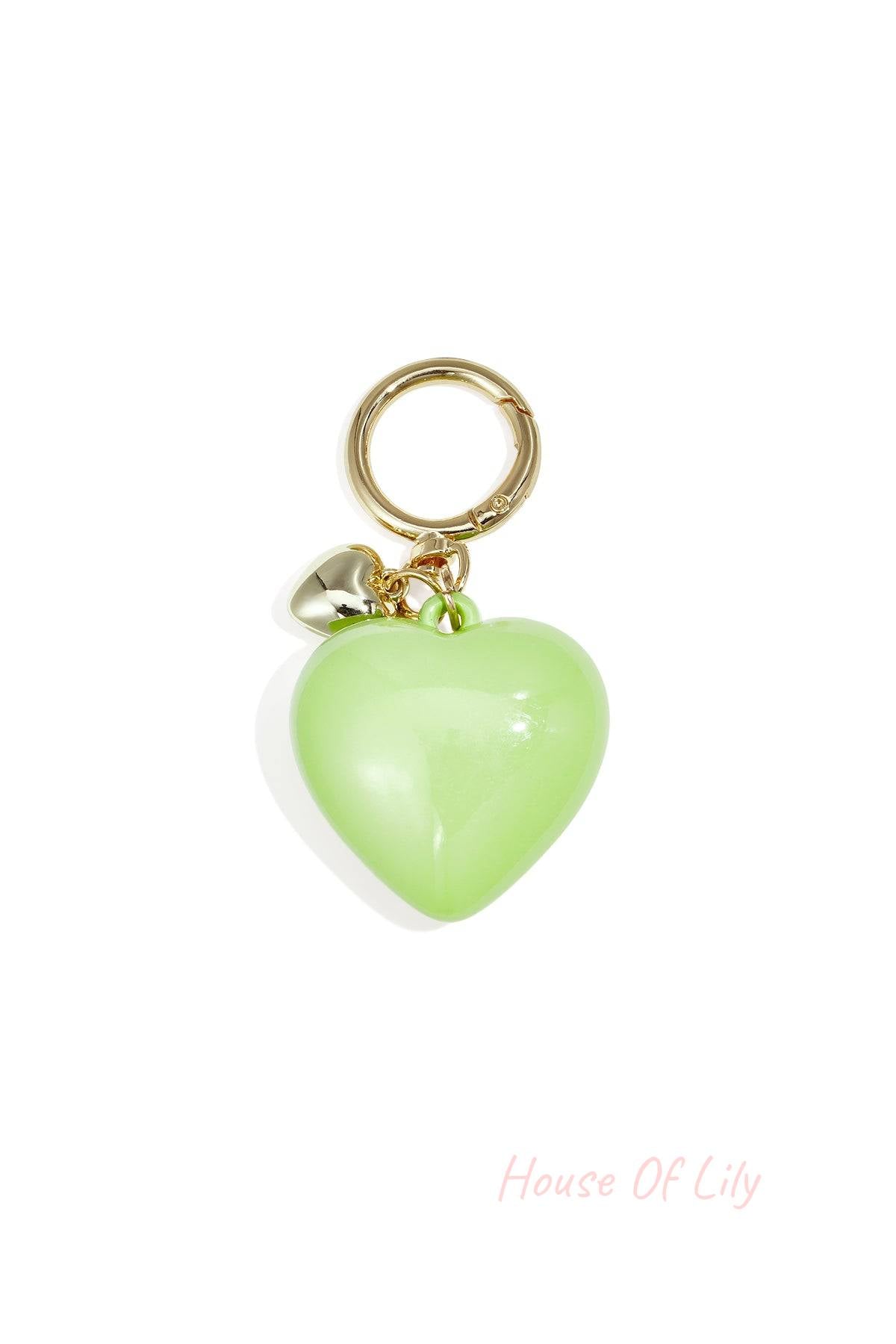 Glossy light green heart-shaped acrylic bag charm with gold alloy ring and tiny heart charm