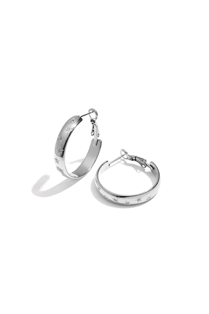 Silver star-embellished hoop earrings with rhinestone accents on white background