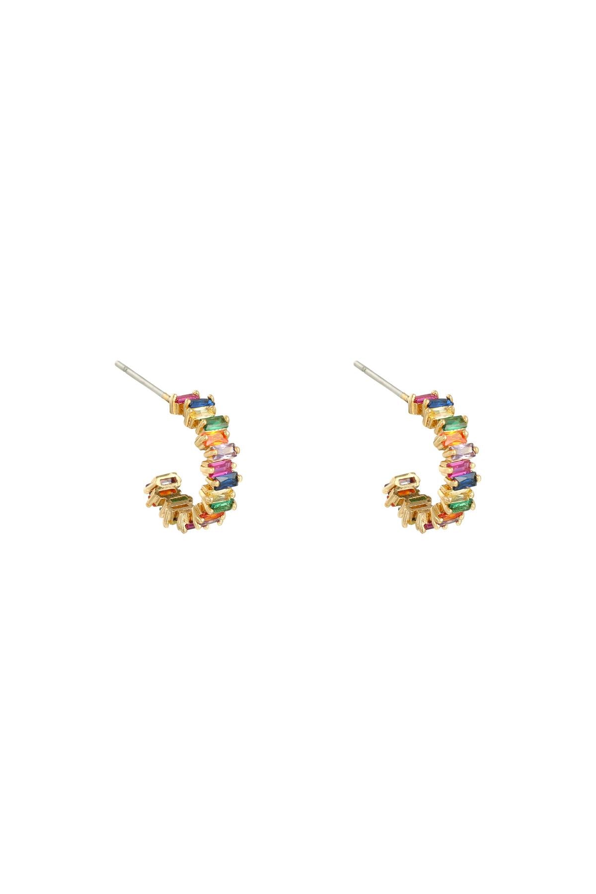 Gold-tone semi-circle hoop earrings with green baguette crystals shown on white background