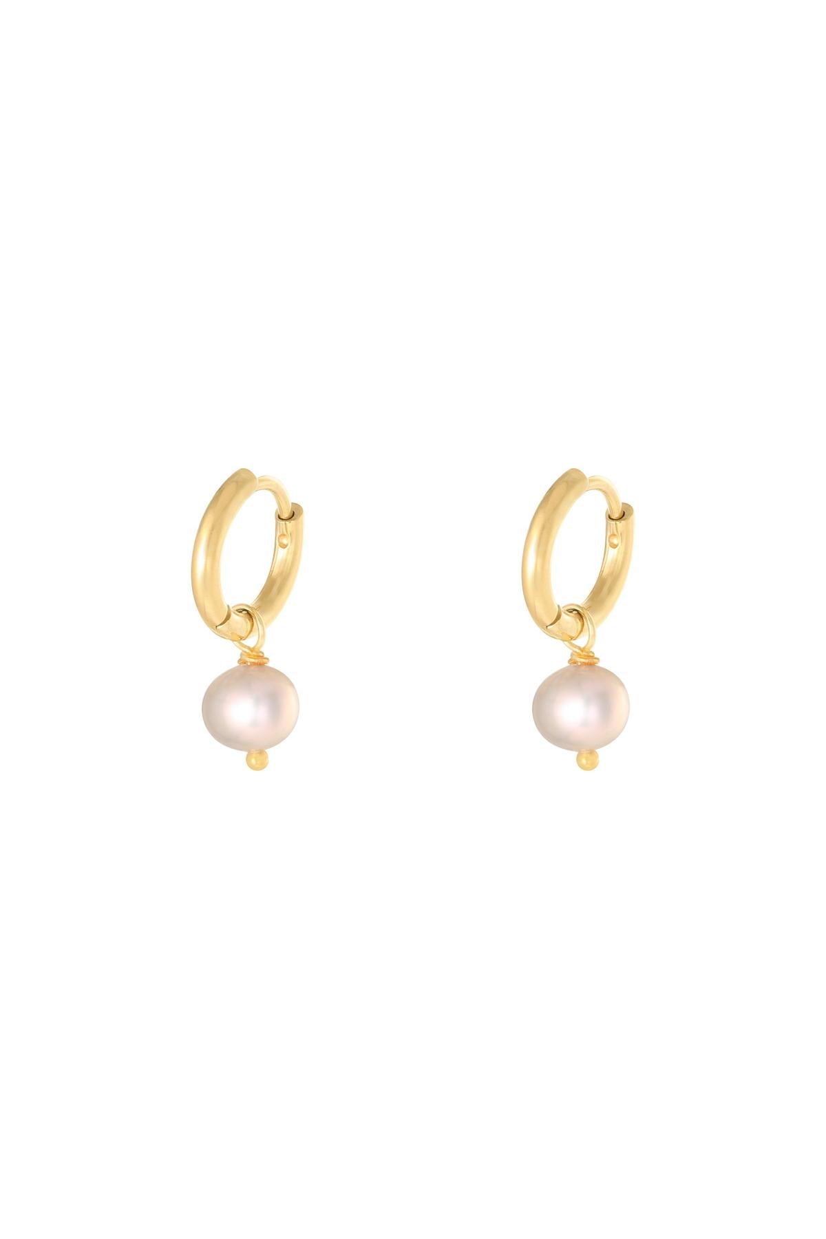 Pair of gold hoop earrings with dangling white pearl charms displayed on a white background.
