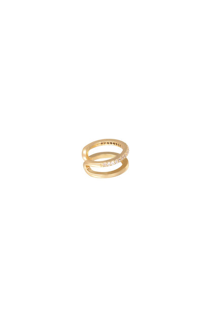Gold double band ear cuff with one band studded with small clear crystals on a white background