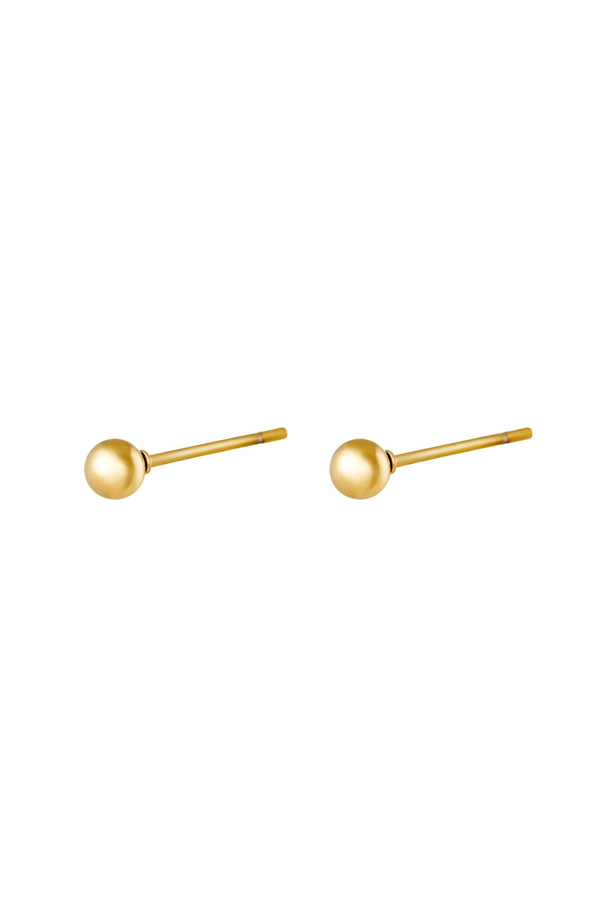 Pair of minimalist gold ball stud earrings isolated on white background