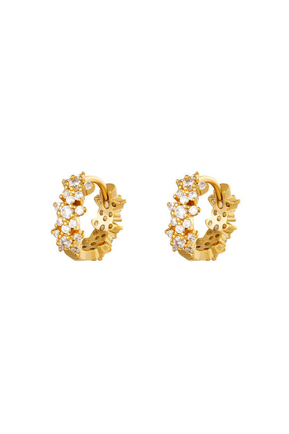 Close-up image of gold plated hoop earrings with cluster of clear rhinestones