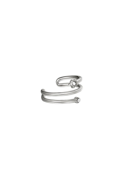 Silver spiral earcuff with small zircon stones on a white background