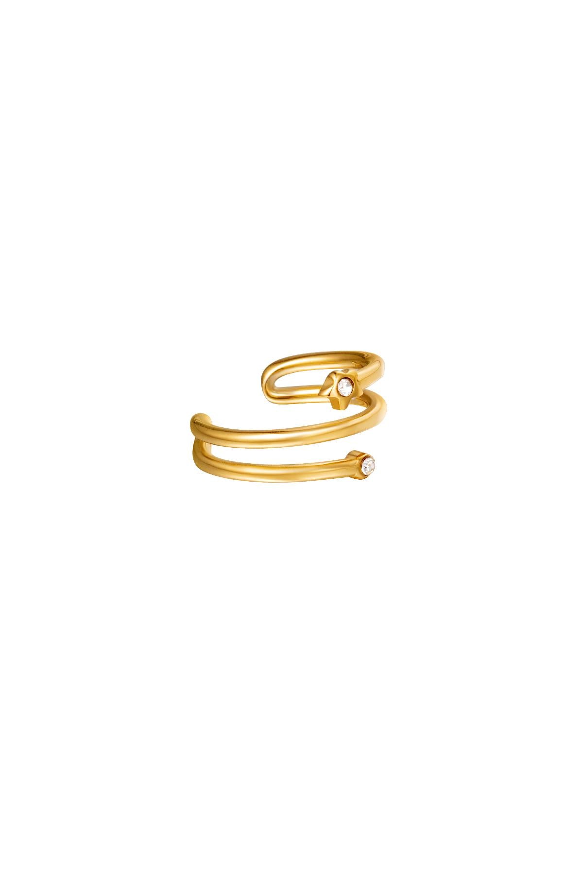 Gold spiral earcuff with small zircon stones on a white background